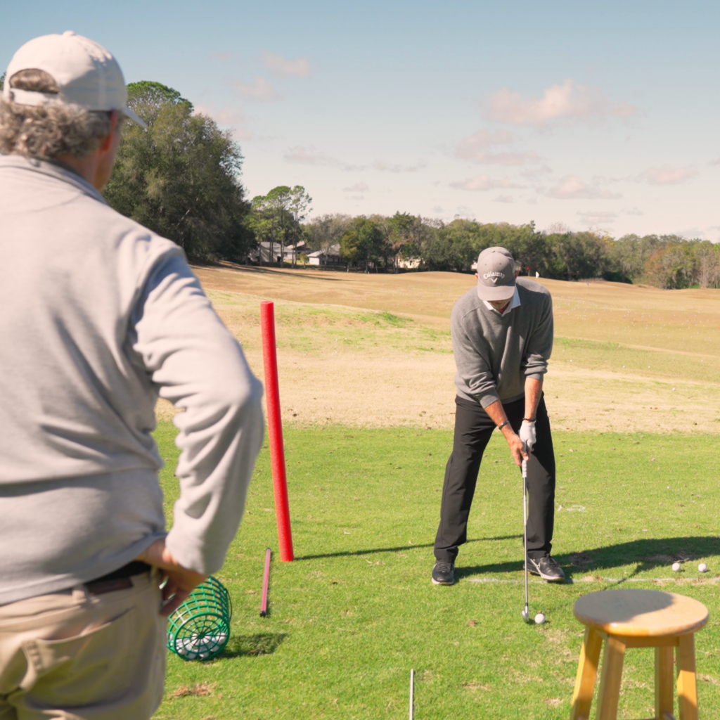 Tom coaching a group of students