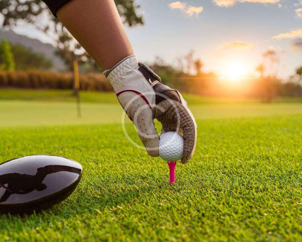 Golf ball positioned perfectly for a shot, with the copyright logo visible in the image.