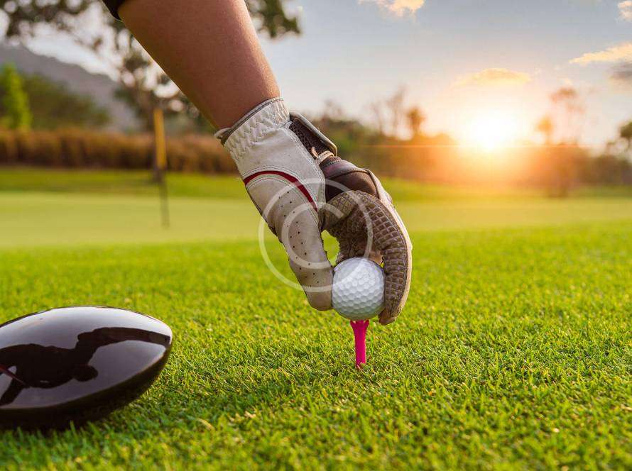 Golf ball positioned perfectly for a shot, with the copyright logo visible in the image.