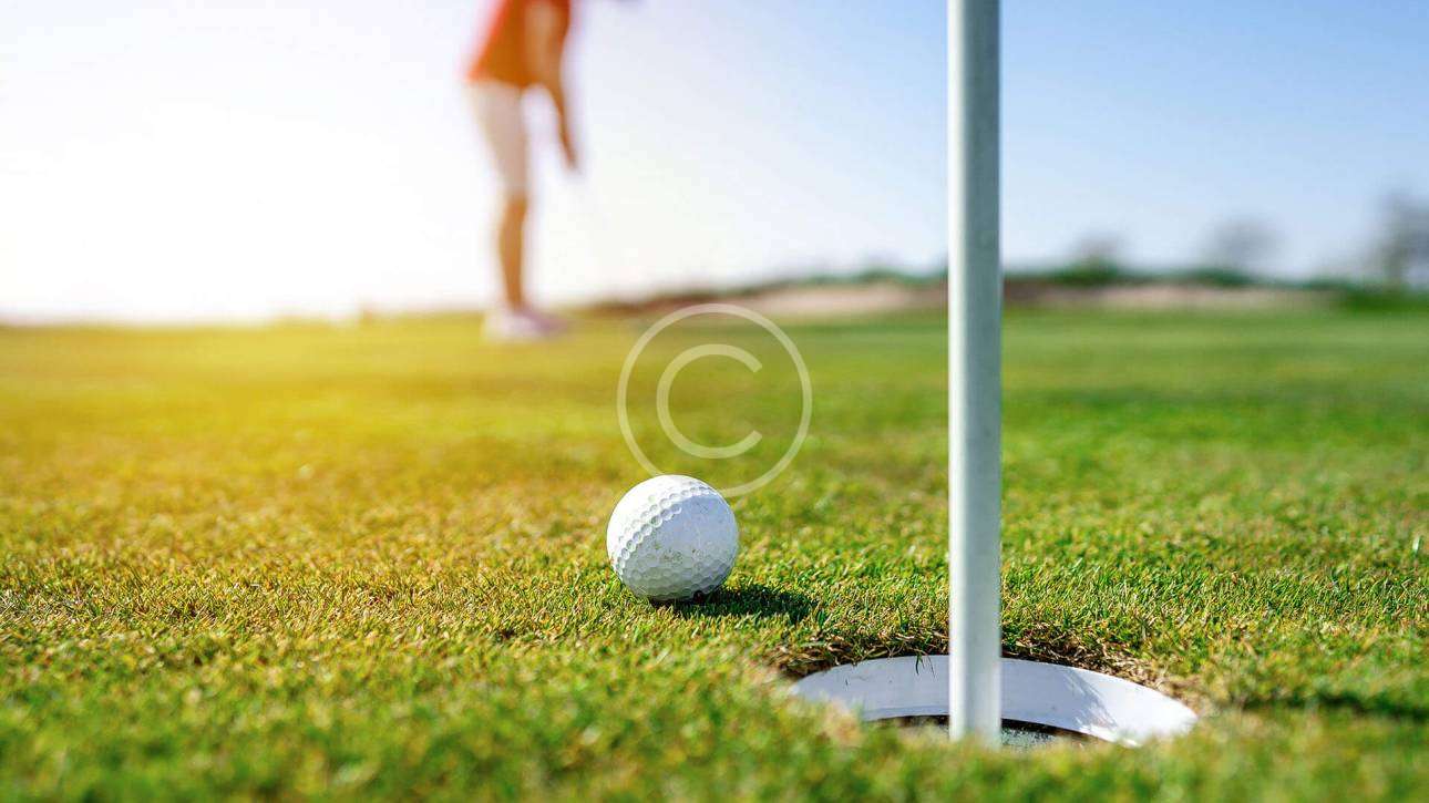 Choosing a good golf instructor with a copyright logo.