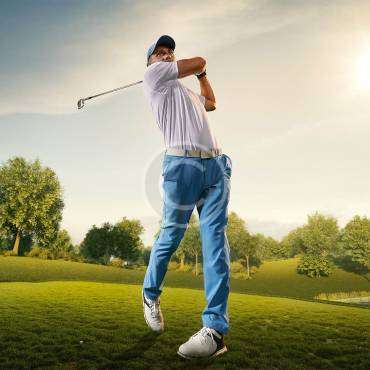 A man in a follow-through position with a golfing stick after hitting the ball, with a copyright logo.