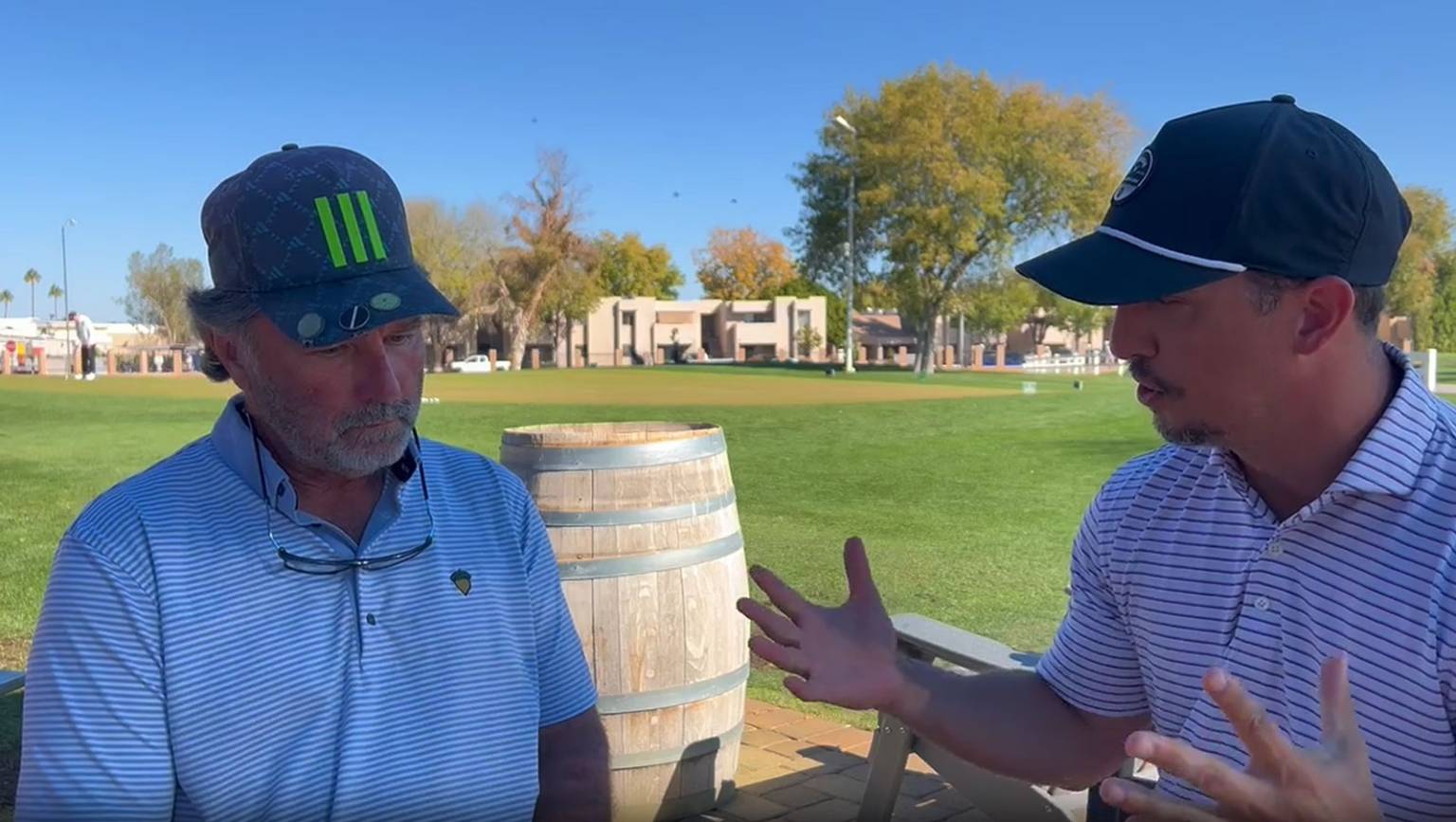 In-person golf lesson with a coach providing hands-on instruction.