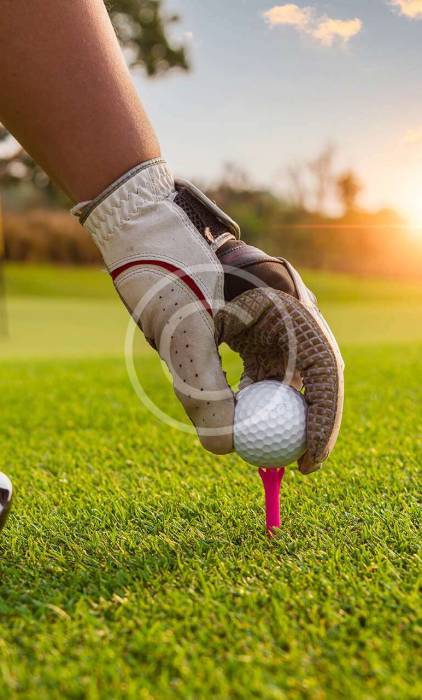 Golf ball positioned perfectly for a shot, with the copyright logo visible in the image.