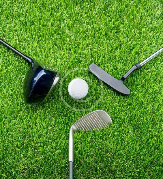 Three golf clubs arranged with a golf ball in the center, ready for action.